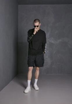 URBAN CLASSICS Nylon Cargo Shorts - Shorts - Black 13 URBAN CLASSICS Nylon Cargo Shorts - Shorts - Black -Negozio Di Abbigliamento Zalando 6b7e3b031ad043268f844ed527bc253e